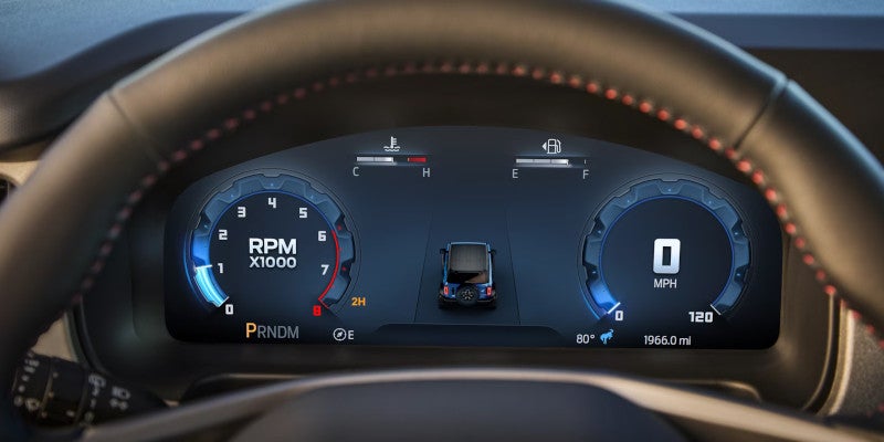 Digital car dashboard showing RPM, 0 MPH, fuel, temperature, and a small vehicle icon.