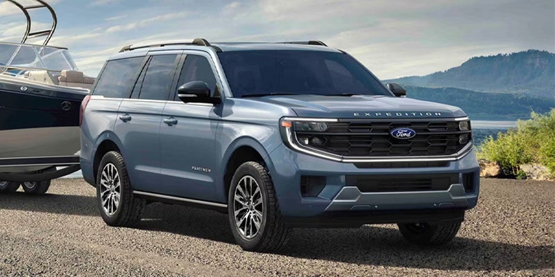 Silver Ford Expedition SUV parked outdoors.