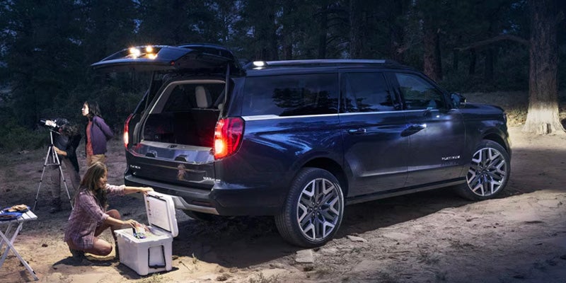 Open rear cargo area at a campsite.