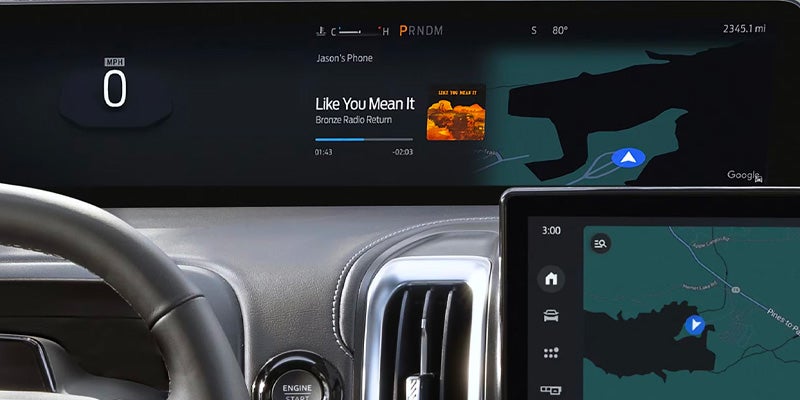 Vehicle infotainment screen with media controls.