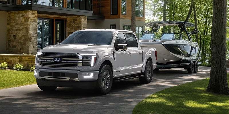 Silver Ford F-150 parked in a residential neighborhood.