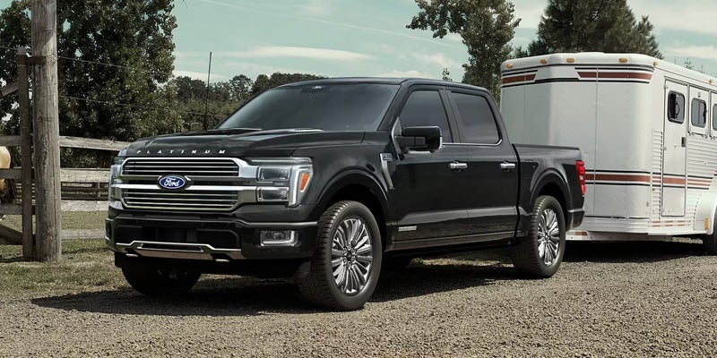 Black Ford F-150 parked outdoors.
