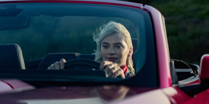 Driver visible through the Mustang windshield.