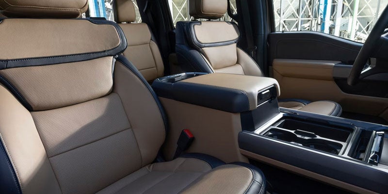 Front cabin with leather seats and center console.