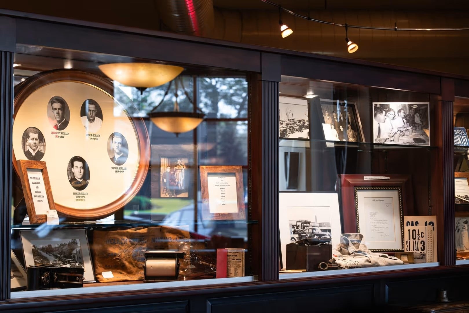 Historical automotive memorabilia displayed in a museum-style exhibit case